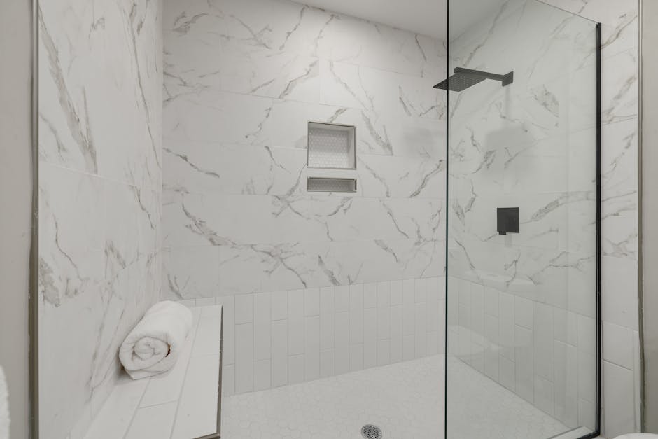 Luxury walk in shower design with glass doors